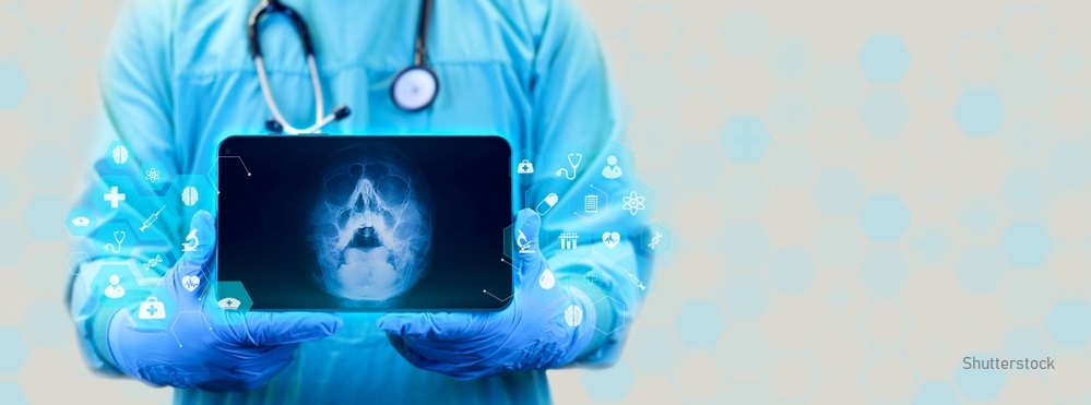 The,Doctor,Holds,A,Tablet,And,Examines,An,X-ray,Of